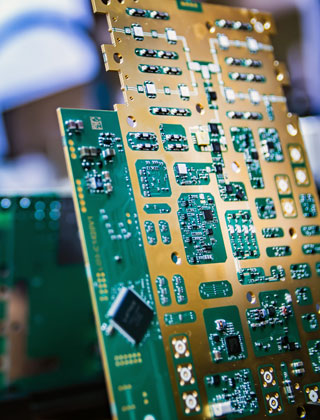Close-up of a circuit board in a PCB manufacturing facility in the US.