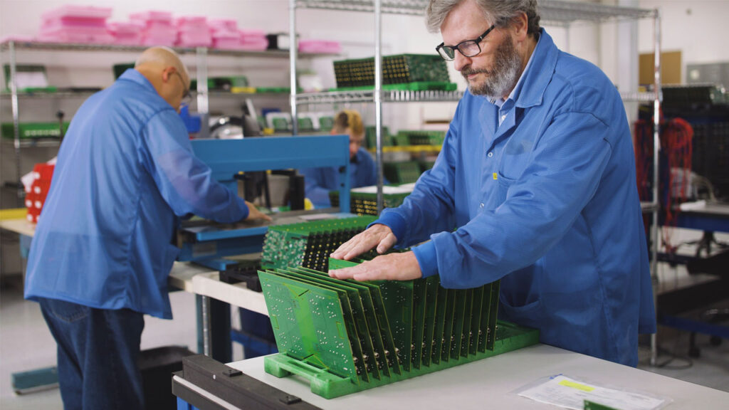 Employees at Foxtronics EMS, assembling printed circuit boards for Industrial Automation applications.